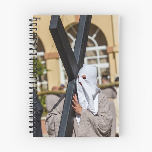 Item preview, Hooded Penitent Carrying Large Cross During Holy Week Religious Procession in Town Square designed and sold by Nmallia.