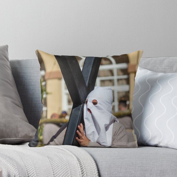 Item preview, Hooded Penitent Carrying Large Cross During Holy Week Religious Procession in Town Square designed and sold by Nmallia.