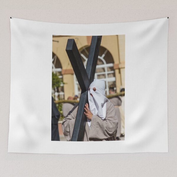 Item preview, Hooded Penitent Carrying Large Cross During Holy Week Religious Procession in Town Square designed and sold by Nmallia.