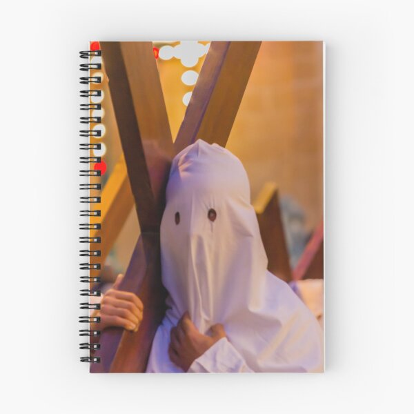 Item preview, Hooded Penitent Carrying Large Cross During Holy Week Religious Procession in Town Square designed and sold by Nmallia.
