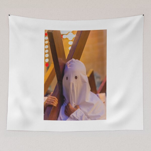 Item preview, Hooded Penitent Carrying Large Cross During Holy Week Religious Procession in Town Square designed and sold by Nmallia.