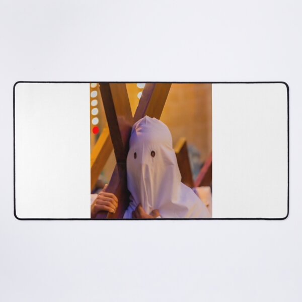 Item preview, Hooded Penitent Carrying Large Cross During Holy Week Religious Procession in Town Square designed and sold by Nmallia.