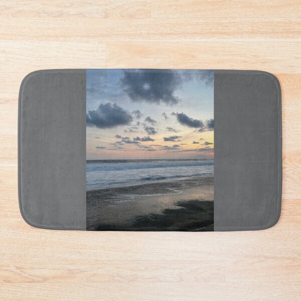 Item preview, Dramatic evening clouds over a calm ocean and dark beach designed and sold by Art of Momenz.