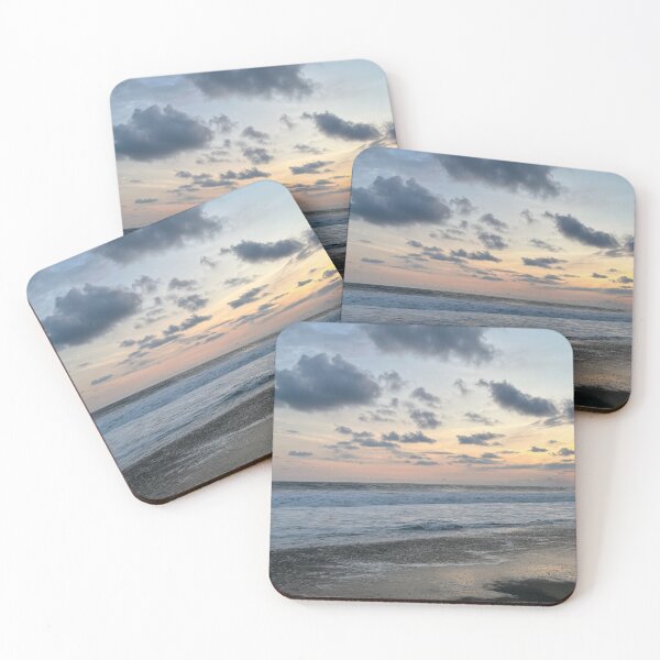 Item preview, Dramatic evening clouds over a calm ocean and dark beach designed and sold by Art of Momenz.