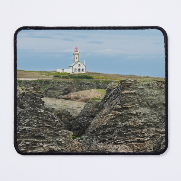 Item preview, Lighthouse On Rugged Coastline: White Building With Red Roof Beside Jagged Rocks designed and sold by FotoMahieu.