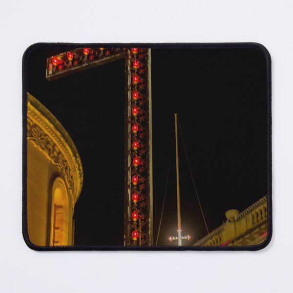 Item preview, Illuminated Red Light Cross At Night Above Historic Church Buildings And Street Lamps designed and sold by Nmallia.