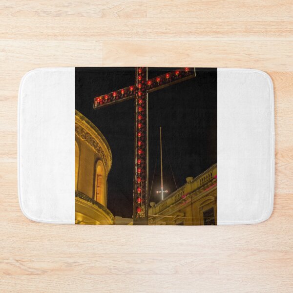 Item preview, Illuminated Red Light Cross At Night Above Historic Church Buildings And Street Lamps designed and sold by Nmallia.
