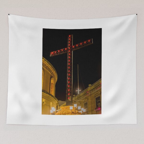Item preview, Illuminated Red Light Cross At Night Above Historic Church Buildings And Street Lamps designed and sold by Nmallia.