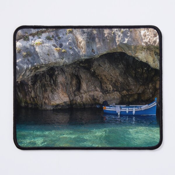 Item preview, Sunlit Blue Fishing Boat Sheltered in Rocky Sea Cave With Crystal Clear Turquoise Water designed and sold by Nmallia.