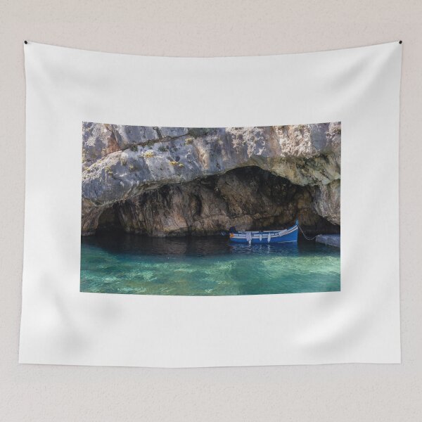 Item preview, Sunlit Blue Fishing Boat Sheltered in Rocky Sea Cave With Crystal Clear Turquoise Water designed and sold by Nmallia.