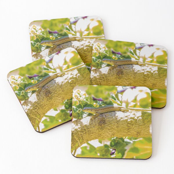 Item preview, Sunlit Lizard Resting on Tree Branch Among Green Leaves and Pink Garden Flowers designed and sold by Nmallia.