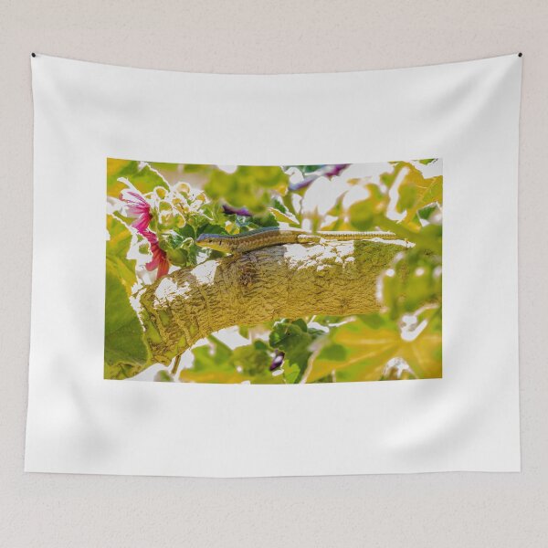 Item preview, Sunlit Lizard Resting on Tree Branch Among Green Leaves and Pink Garden Flowers designed and sold by Nmallia.