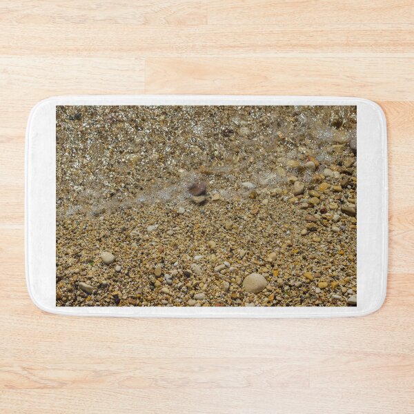 Item preview, Pebble Beach Shoreline With Clear Shallow Water, Gentle Wave Foam And Sunlit Stones designed and sold by Nmallia.
