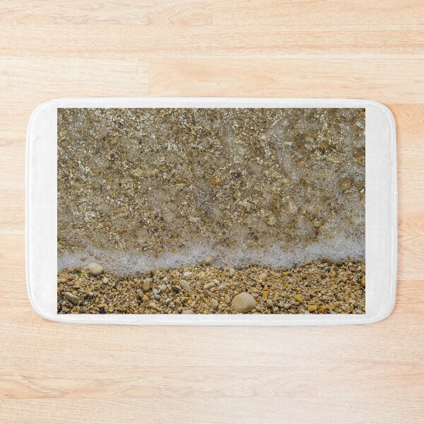 Item preview, Pebble Beach Shoreline With Clear Shallow Water, Gentle Wave Foam And Sunlit Stones designed and sold by Nmallia.
