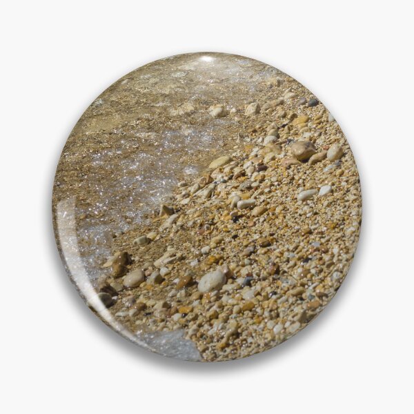 Item preview, Pebble Beach Shoreline With Clear Shallow Water, Gentle Wave Foam And Sunlit Stones designed and sold by Nmallia.