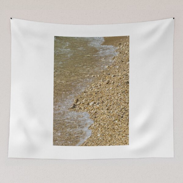 Item preview, Pebble Beach Shoreline With Clear Shallow Water, Gentle Wave Foam And Sunlit Stones designed and sold by Nmallia.