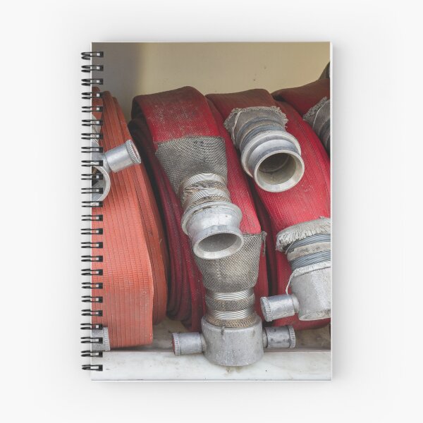 Item preview, Stacked Red Fire Hoses With Metal Couplings On A Fire Truck Shelf For Firefighting Readiness designed and sold by Nmallia.