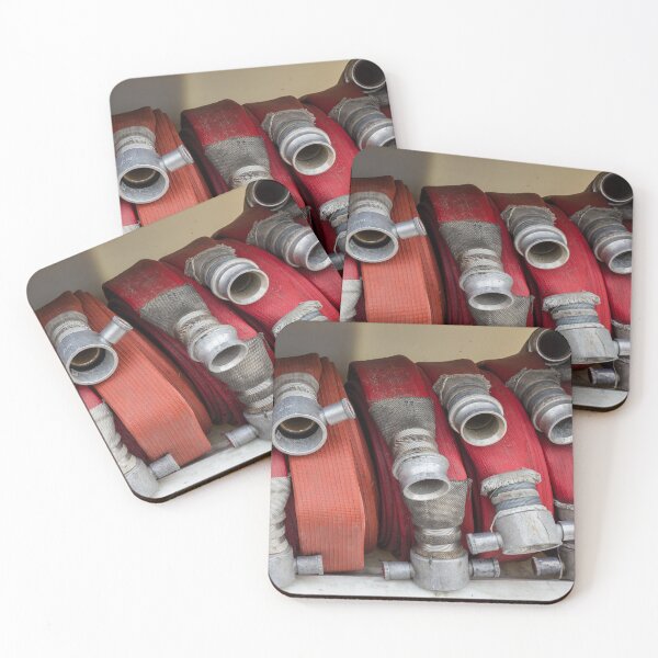 Item preview, Stacked Red Fire Hoses With Metal Couplings On A Fire Truck Shelf For Firefighting Readiness designed and sold by Nmallia.