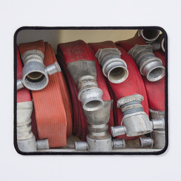 Item preview, Stacked Red Fire Hoses With Metal Couplings On A Fire Truck Shelf For Firefighting Readiness designed and sold by Nmallia.