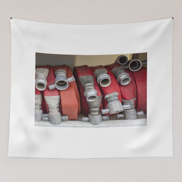 Item preview, Stacked Red Fire Hoses With Metal Couplings On A Fire Truck Shelf For Firefighting Readiness designed and sold by Nmallia.