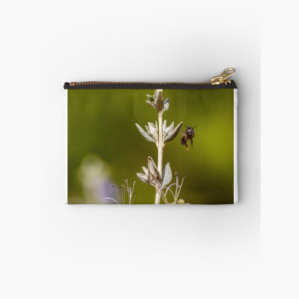 Item preview, Macro Shot Of Purple Wildflower With Bee In Flight On Soft Green Background designed and sold by Nmallia.