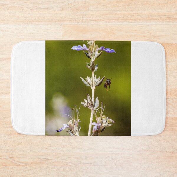 Item preview, Macro Shot Of Purple Wildflower With Bee In Flight On Soft Green Background designed and sold by Nmallia.