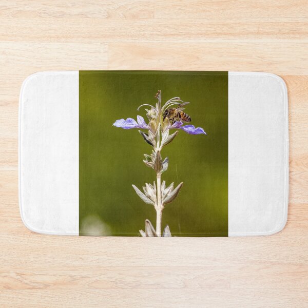 Item preview, Macro Shot Of Purple Wildflower With Bee In Flight On Soft Green Background designed and sold by Nmallia.