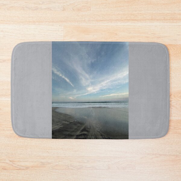 Item preview, A vast ocean with subtle beach reflections beneath a wide cloudy sky. designed and sold by Art of Momenz.