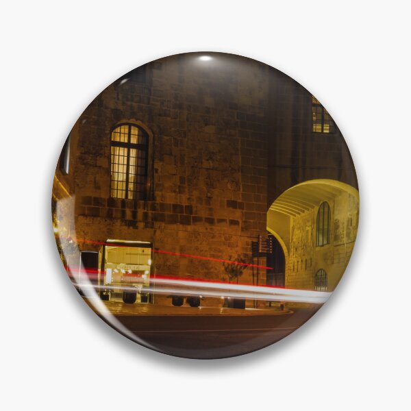 Item preview, Night Light Trails Through Historic Stone Archway On Curved Urban Street Under Warm Lighting designed and sold by Nmallia.