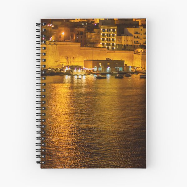 Item preview, Night Harbor With Small Boat and Historic Waterfront Fortress Illuminated by City Lights and Golden Reflections designed and sold by Nmallia.