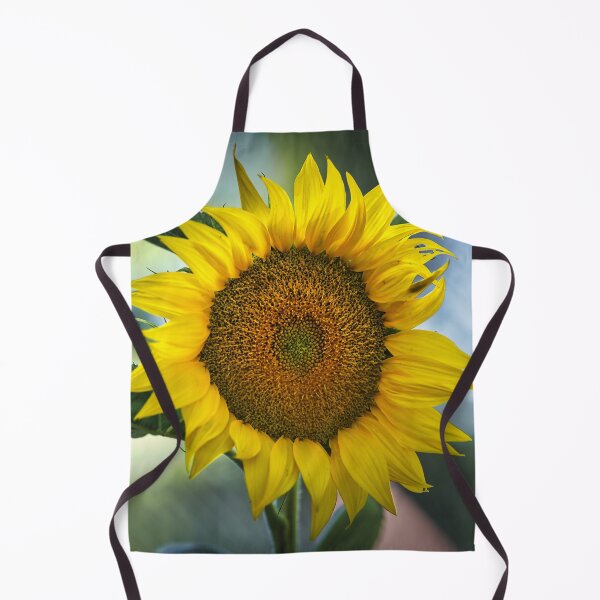 Item preview, Close-up of a yellow sunflower bloom with detailed seed head, bright petals and soft green bokeh background in natural light designed and sold by RastislavS.