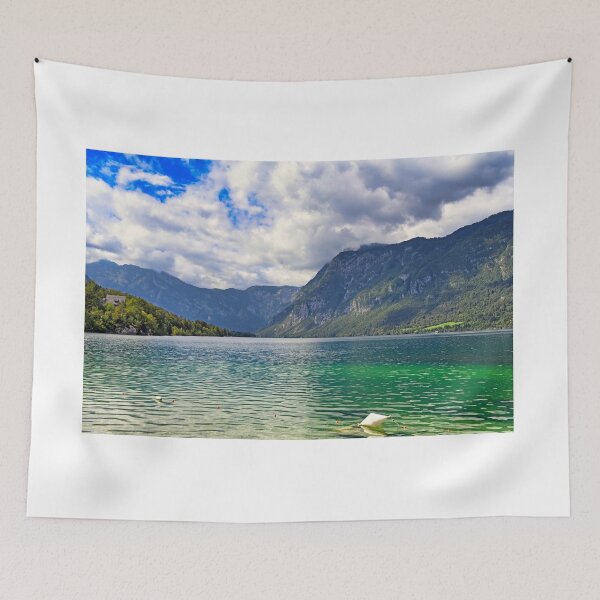 Item preview, Bohinj Lake in Slovenia. Landscape of the lake with green water and mountains in background designed and sold by goceris.