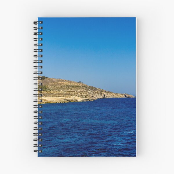 Item preview, Blue Sea and Rocky Coastline Under Clear Sky Overlooking a Quiet Coastal Landscape designed and sold by Nmallia.