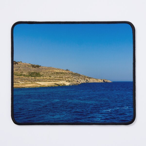Item preview, Blue Sea and Rocky Coastline Under Clear Sky Overlooking a Quiet Coastal Landscape designed and sold by Nmallia.