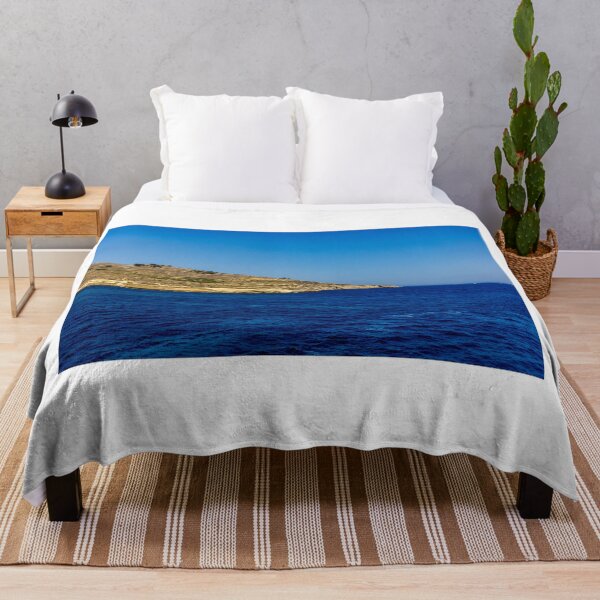 Item preview, Blue Sea and Rocky Coastline Under Clear Sky Overlooking a Quiet Coastal Landscape designed and sold by Nmallia.