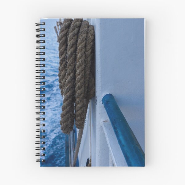 Item preview, Thick Mooring Rope Coiled on Ship Rail With Deep Blue Ocean Background, Nautical Maritime Detail designed and sold by Nmallia.