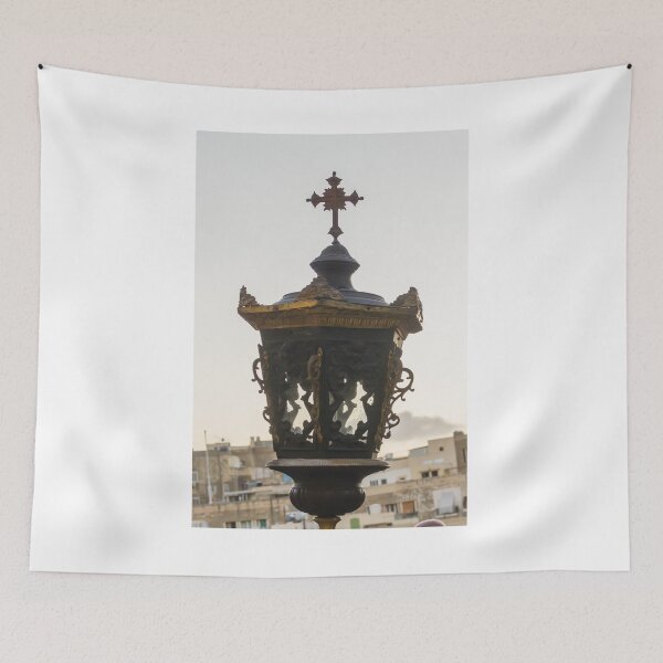 Item preview, Ornate Vintage Street Lantern With Cross Ornament Above An Old Cityscape designed and sold by Nmallia.