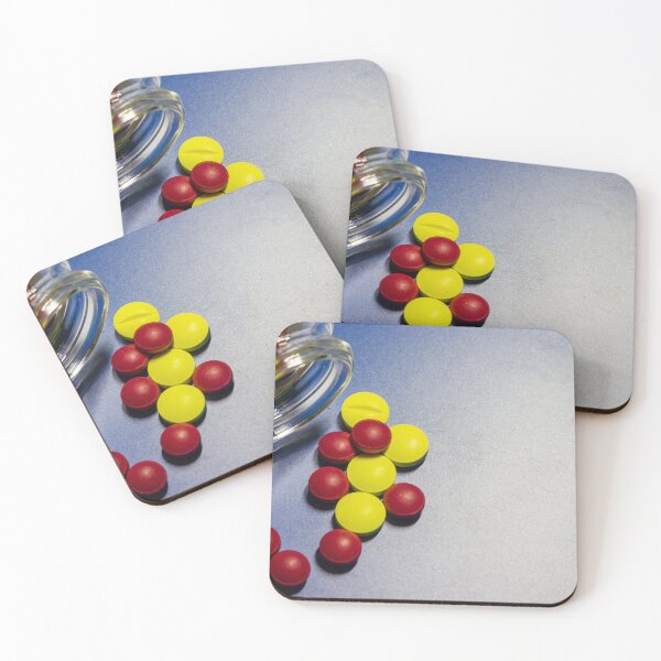 Item preview, Colorful Candy Tablets Spilling From Small Glass Jar On Blue Surface Background designed and sold by Nmallia.