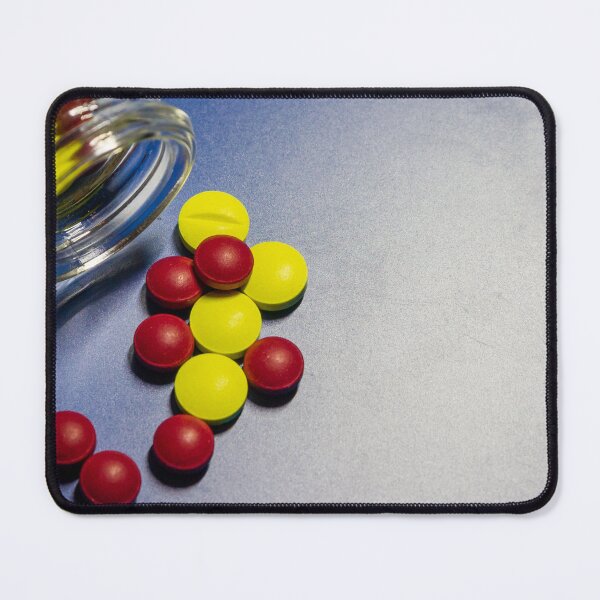 Item preview, Colorful Candy Tablets Spilling From Small Glass Jar On Blue Surface Background designed and sold by Nmallia.