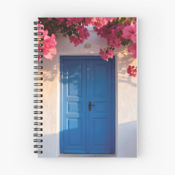 Item preview, Vibrant Pink Bougainvillea Flowers Framing a Blue Mediterranean Door on a White Wall designed and sold by Dezinix.