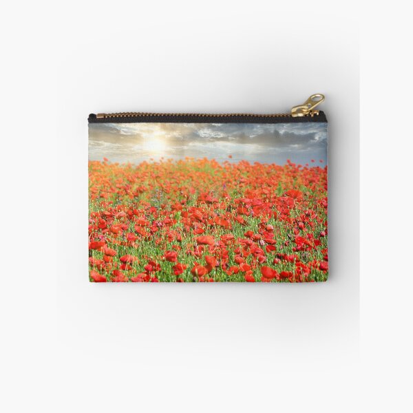 Item preview, The sun's rays break through the clouds and shine on the poppies flower meadow, spring season designed and sold by goceris.