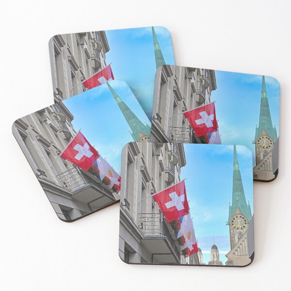 Item preview, A building with a Swiss flag and Grossmunster and Fraumunster church clock towers in the background, Zurich, Switzerland designed and sold by goceris.
