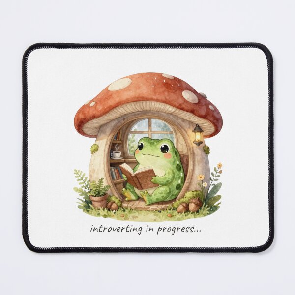 Item preview, Introverting in Progress | Cozy Watercolor Frog Reading in a Mushroom Cottage | Cottagecore Sticker designed and sold by Cozy Chaos Studio Co.