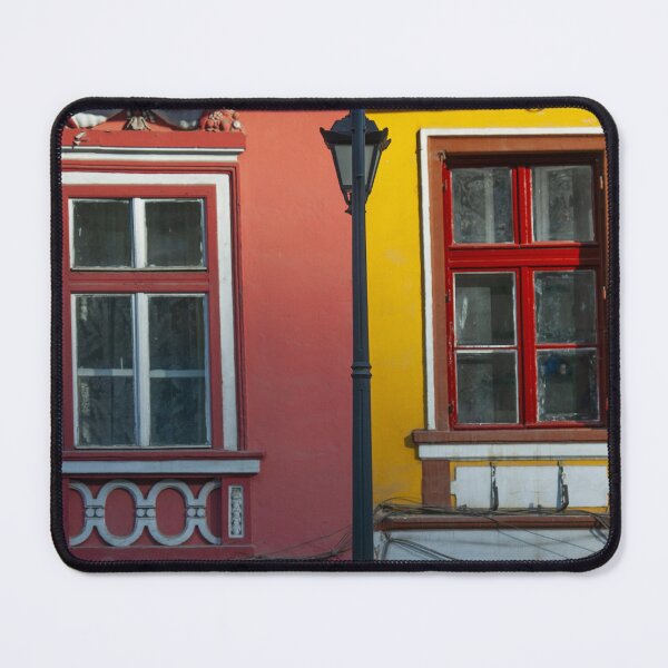 Item preview, Colorful Building Facade With Red Windows designed and sold by Amitphotos.