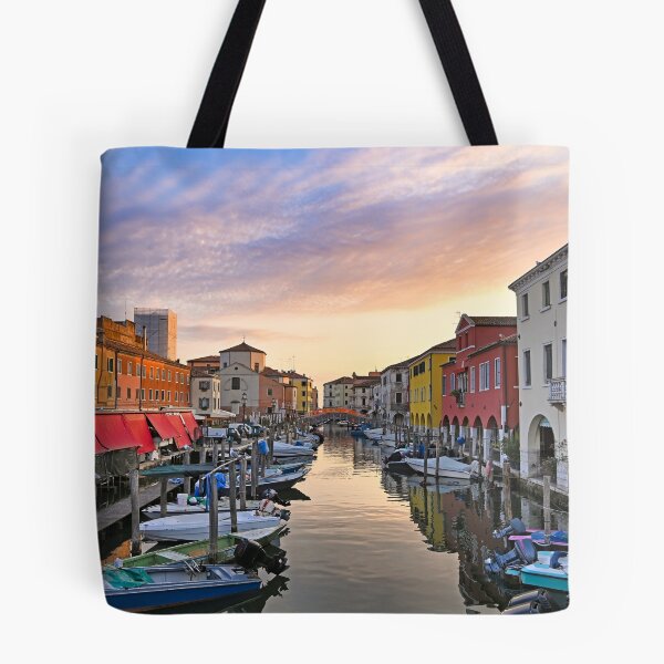 Item preview, Small boats floating in calm water, sunrise over town of Chioggia, Venetian Lagoon, Veneto, Italy.  designed and sold by goceris.
