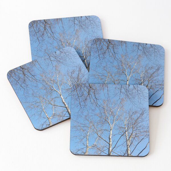 Item preview, Leaflless trees on blue sky background designed and sold by Dniprianka.