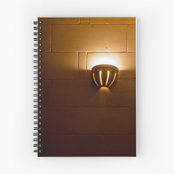 Item preview, Warm Wall Sconce Light Casting Golden Glow On Tiled Brick Interior Wall For Cozy Ambience designed and sold by Nmallia.