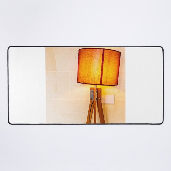 Item preview, Warm Wooden Tripod Floor Lamp With Orange Lampshade Against Stone Wall For Cozy Interior designed and sold by Nmallia.
