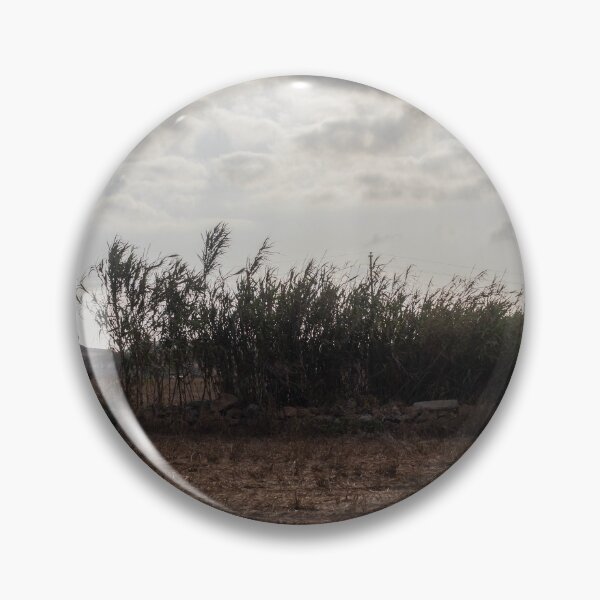 Item preview, Dry Field With Tall Reeds And Dramatic Cloudy Sky Over Rural Mediterranean Landscape designed and sold by Nmallia.