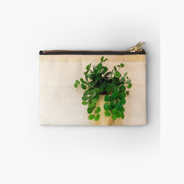 Item preview, Lush Green Hanging Plant Dripping From A Pot On A Pale Stone Wall For Interior Decor designed and sold by Nmallia.